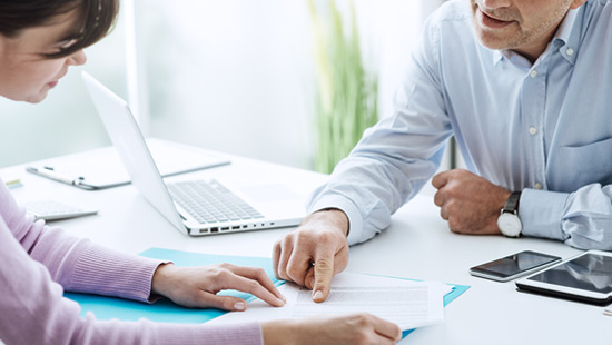 Adviser pointing to a document