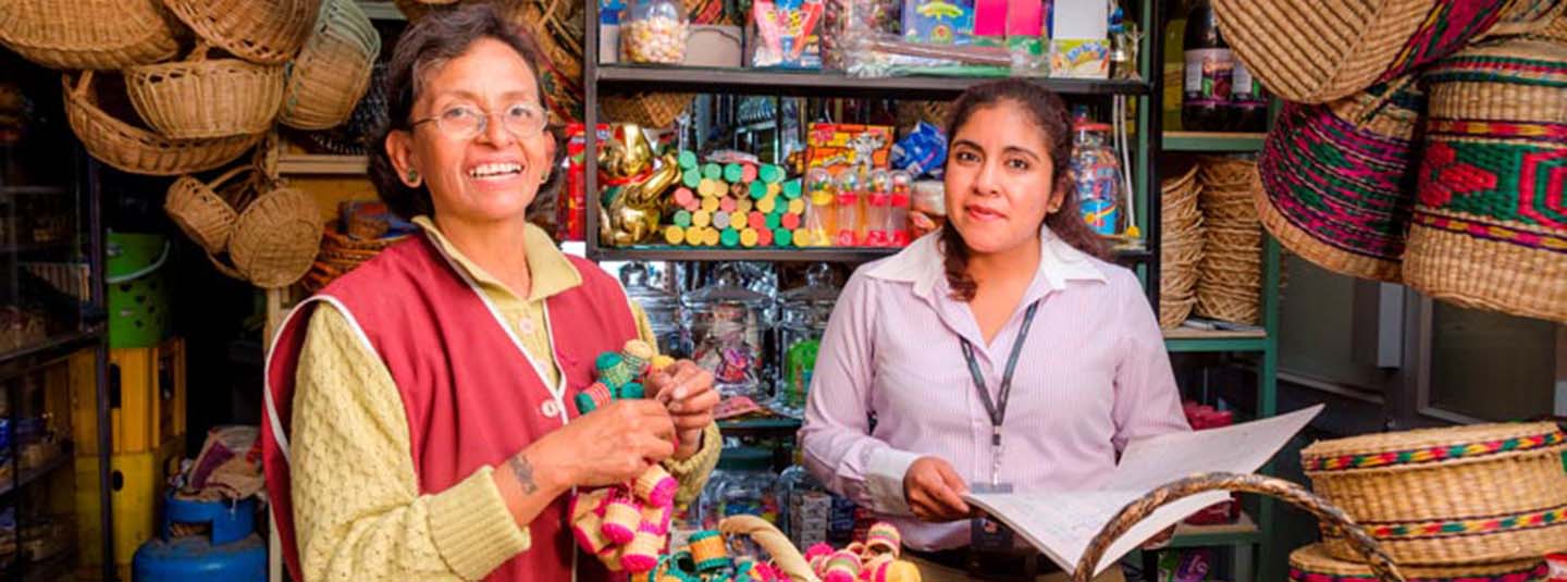 Two women standing in a basket store in Ecuador