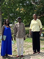 Three people standing outside